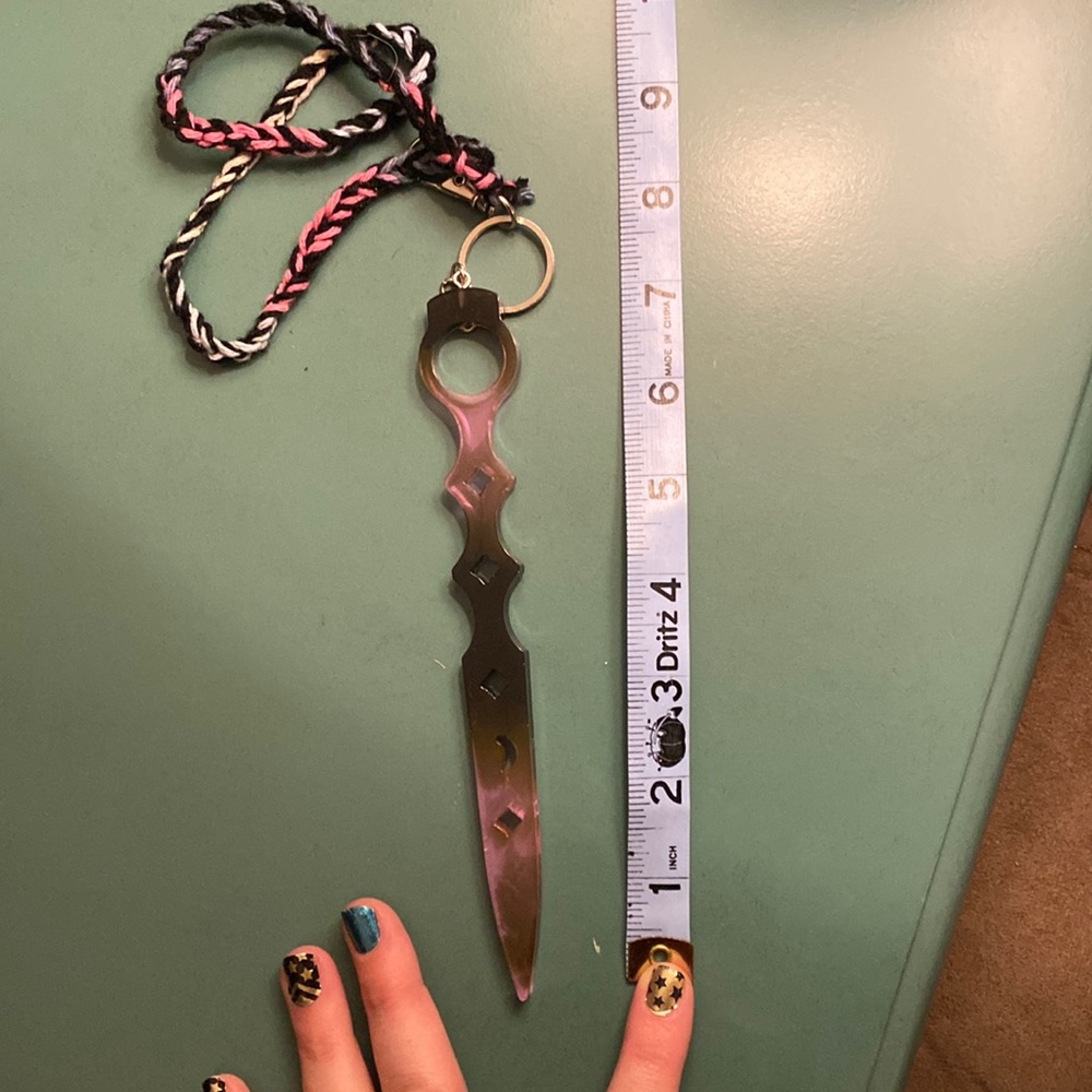 Pink and black resin self-defense keychain
